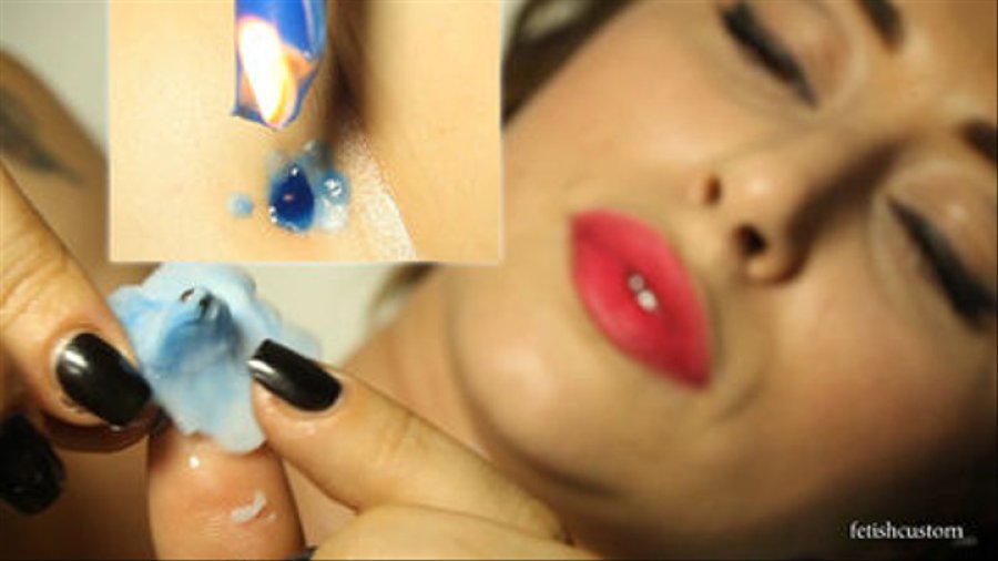 Ammalia drips candle wax into her bellybutton