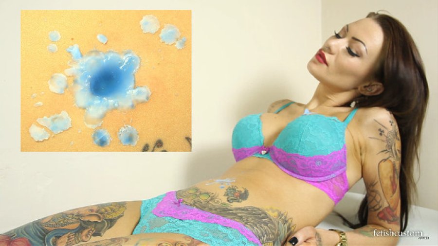 Becky drips candle wax into her bellybutton