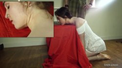 Model Lola Rae Poses Her Neck On A Block